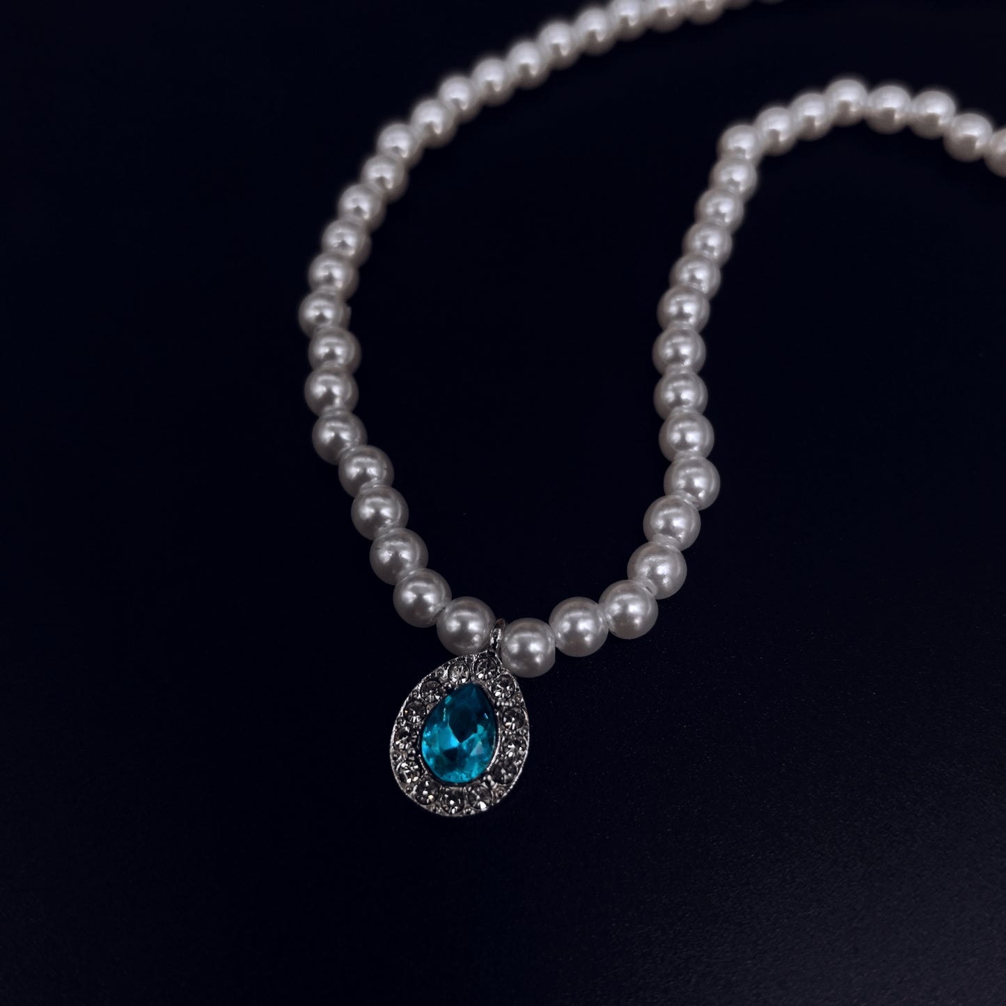 Elegant Pearl Necklace with Blue Crystal Pendant