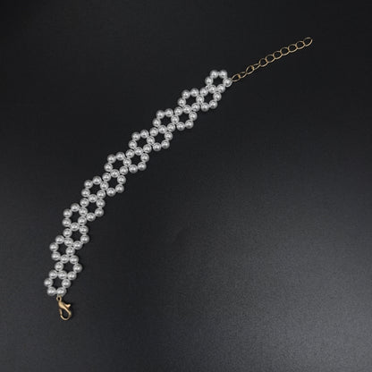 Handcrafted Multi-Row Pearl Bracelet with Gold Chain Detail
