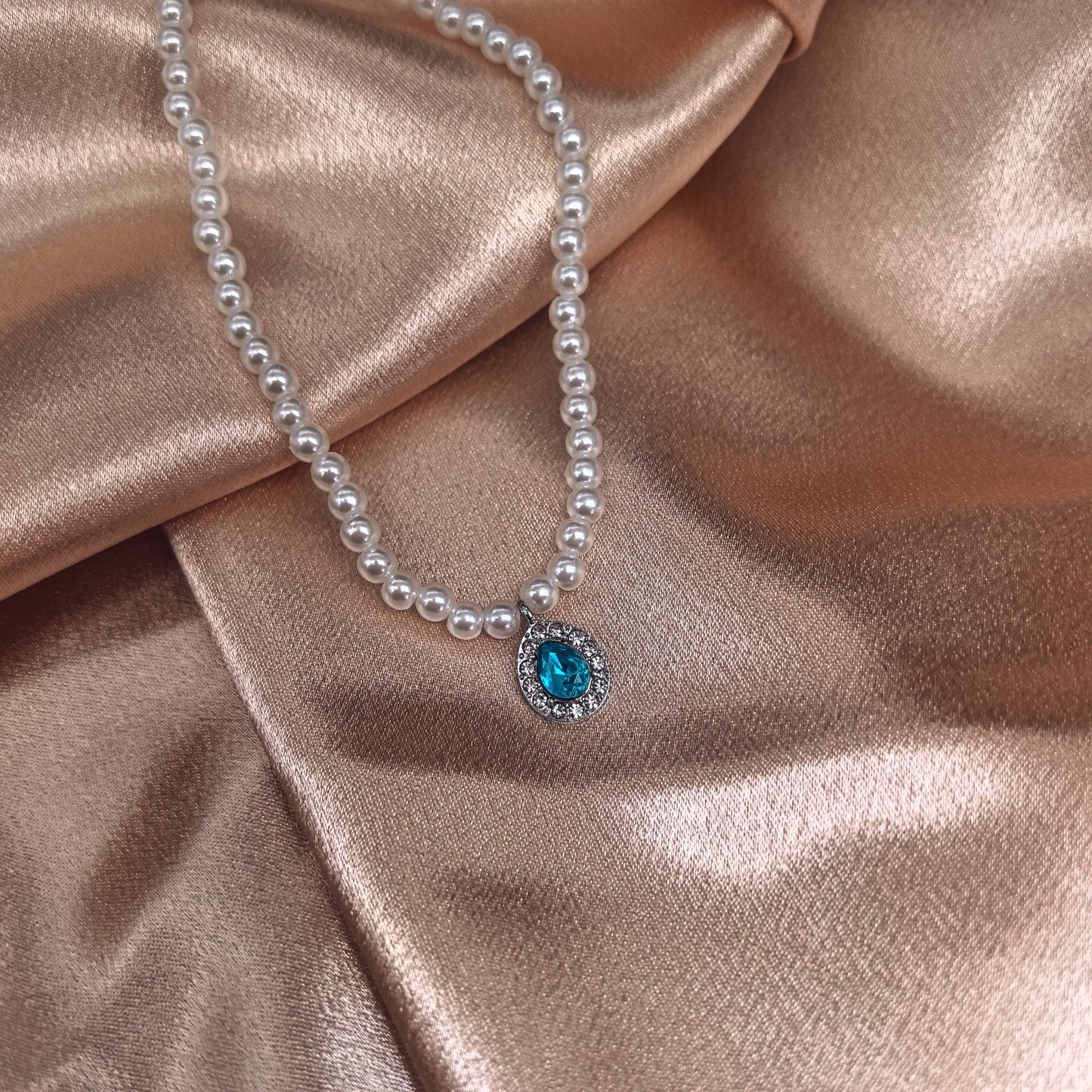 Elegant Pearl Necklace with Blue Crystal Pendant