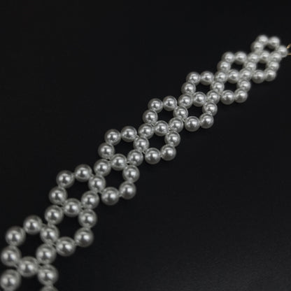 Handcrafted Multi-Row Pearl Bracelet with Gold Chain Detail