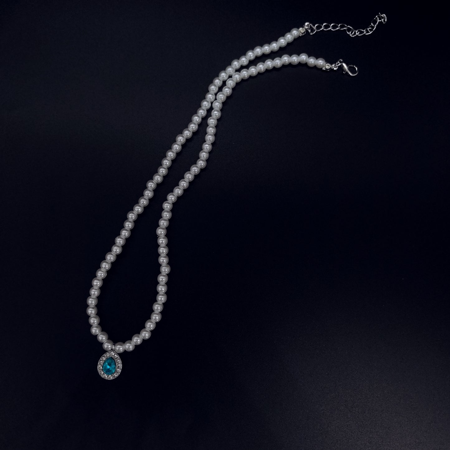 Elegant Pearl Necklace with Blue Crystal Pendant