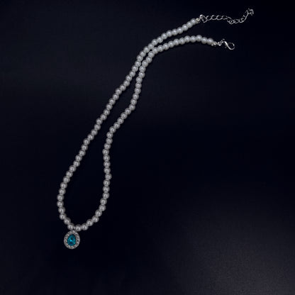Elegant Pearl Necklace with Blue Crystal Pendant