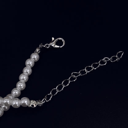 Elegant Pearl Necklace with Blue Crystal Pendant