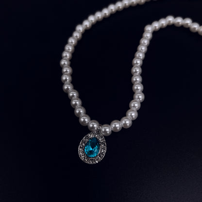 Elegant Pearl Necklace with Blue Crystal Pendant