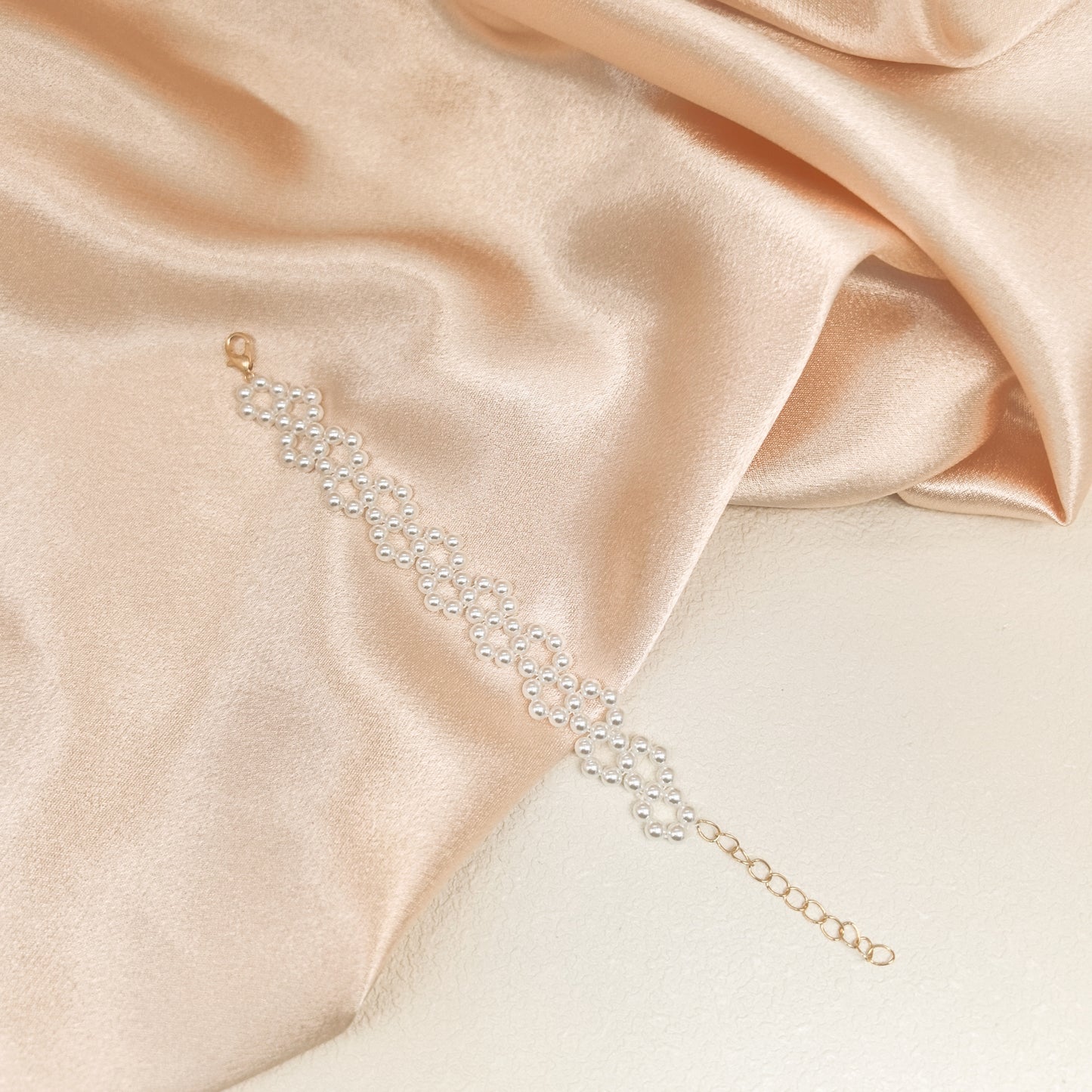 Handcrafted Multi-Row Pearl Bracelet with Gold Chain Detail